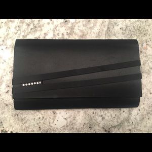 Black clutch, minor wear.